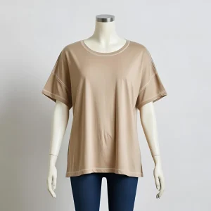 ComfortFit beige t-shirt laid flat, representing comfort and a local t-shirt factory's production.