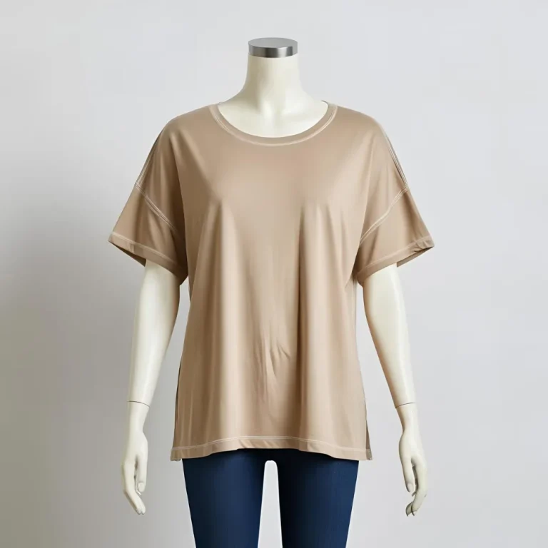 ComfortFit beige t-shirt laid flat, representing comfort and a local t-shirt factory's production.