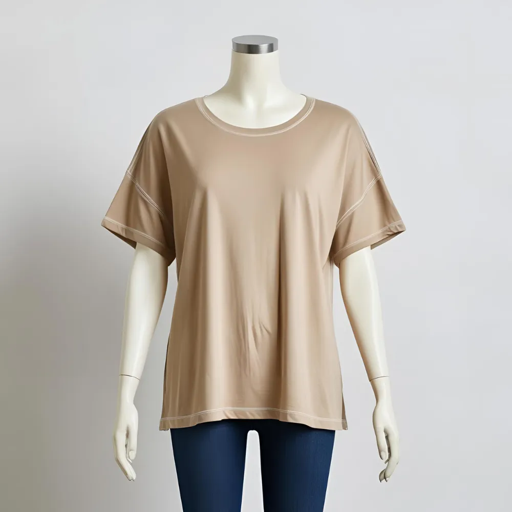 ComfortFit beige t-shirt laid flat, representing comfort and a local t-shirt factory's production.