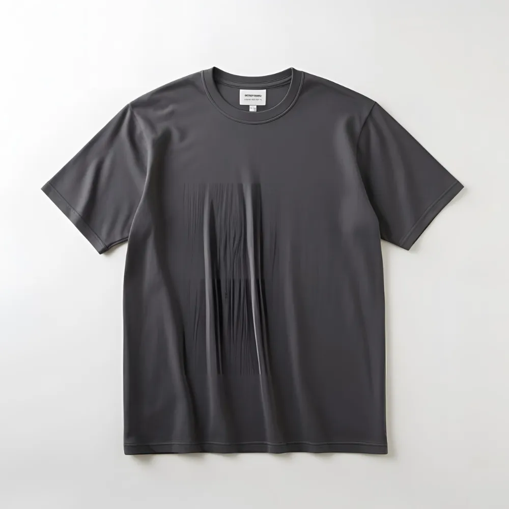 A charcoal grey cotton t-shirt on a white surface, suggesting customization with a brand logo.
