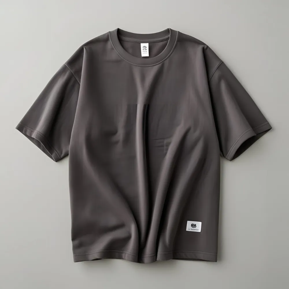 Charcoal grey t-shirt hanging on a hanger, representing a casual essential for custom branding.