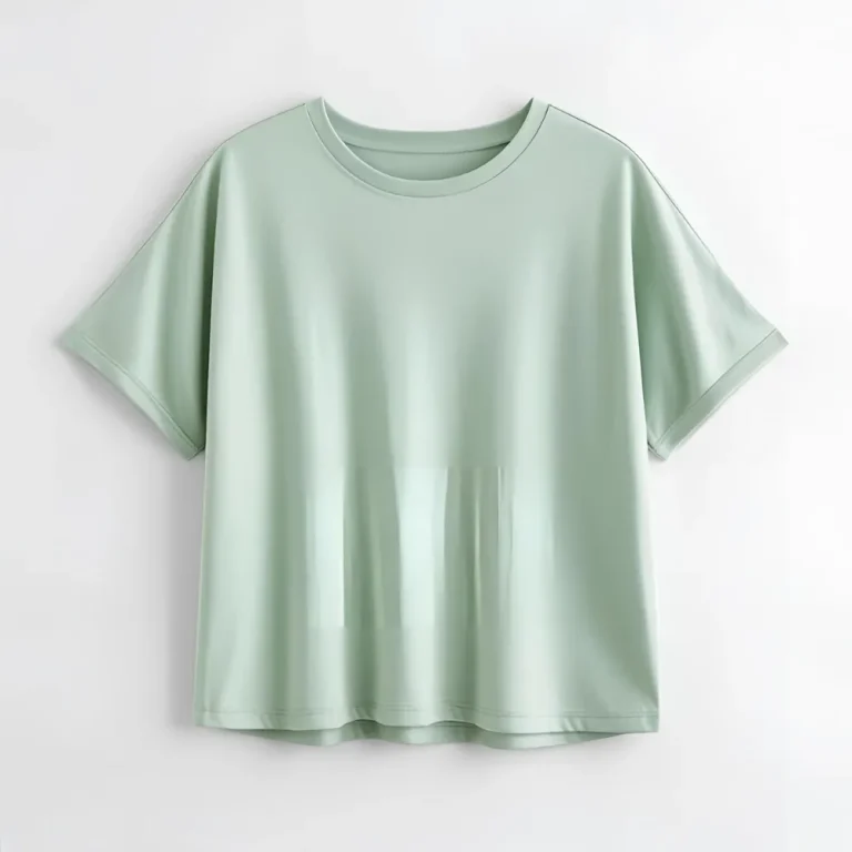Soft pastel green t-shirt displayed flat, emphasizing personalization with a logo or name.
