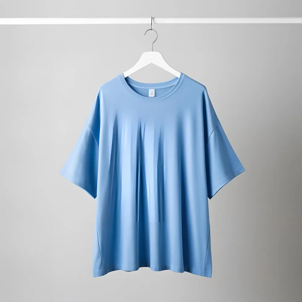 Sky blue ComfortFit t-shirt laid flat, highlighting its relaxed fit for a t-shirt factory.