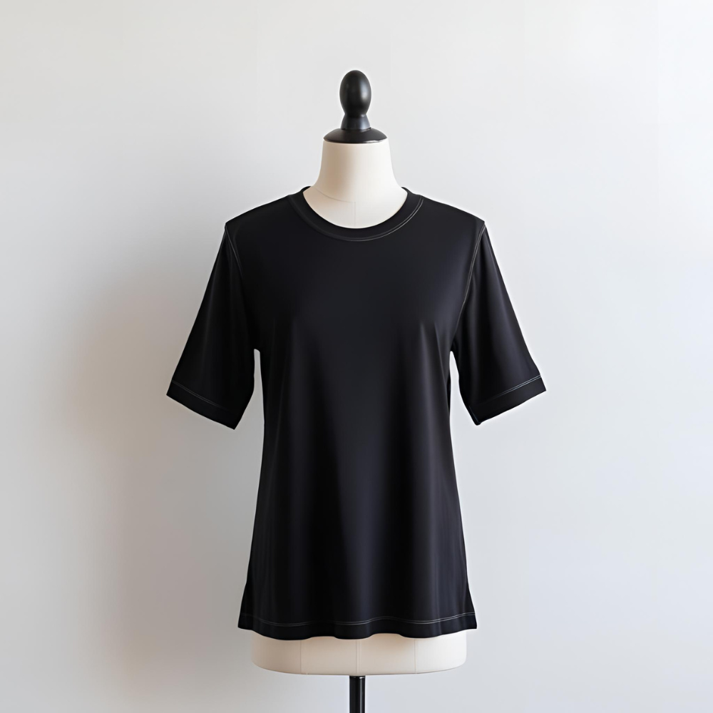 Black t-shirt laid flat, highlighting its pure simplicity for branding from a UK manufacturer.